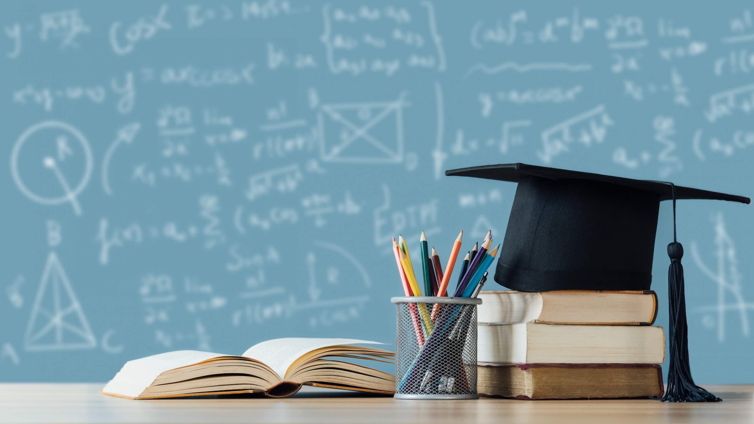 Education,Learning,Concept.,A,Mortarboard,And,Graduation,Scroll,On,Stack