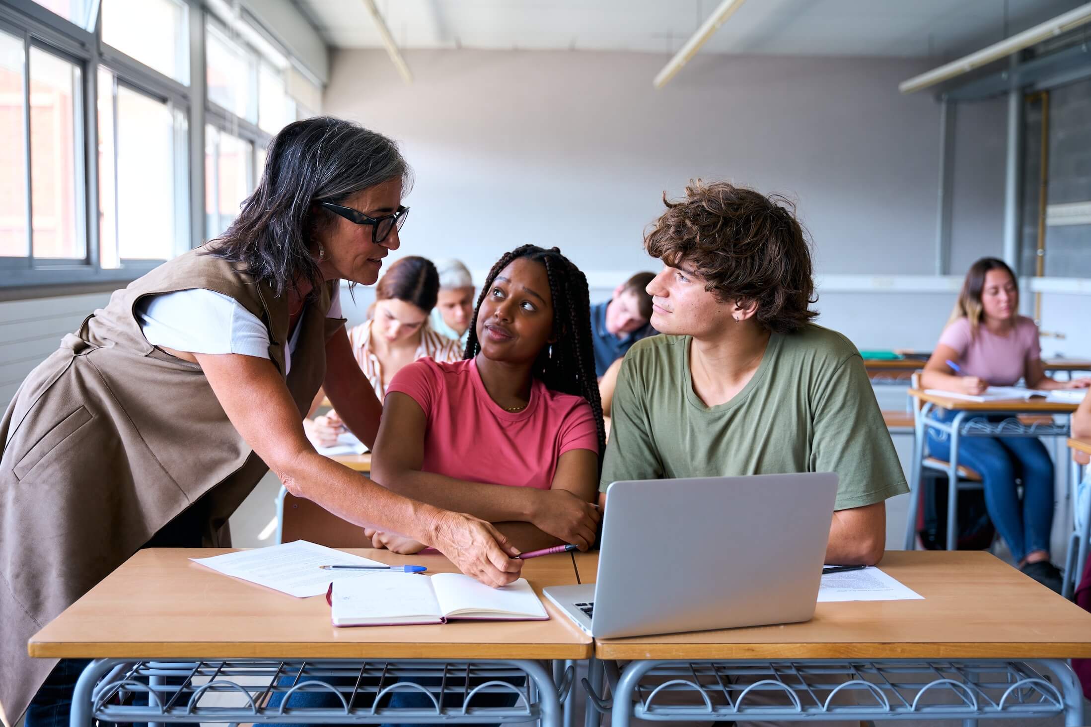 Young,Male,Teacher,Helping,Female,Student,In,Class.,The,Tutor