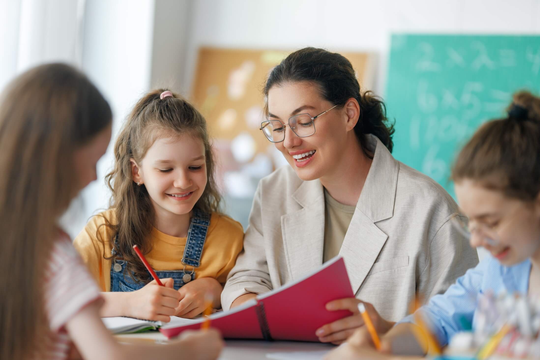 Happy,Kids,And,Teacher,At,School.,Woman,And,Children,Are