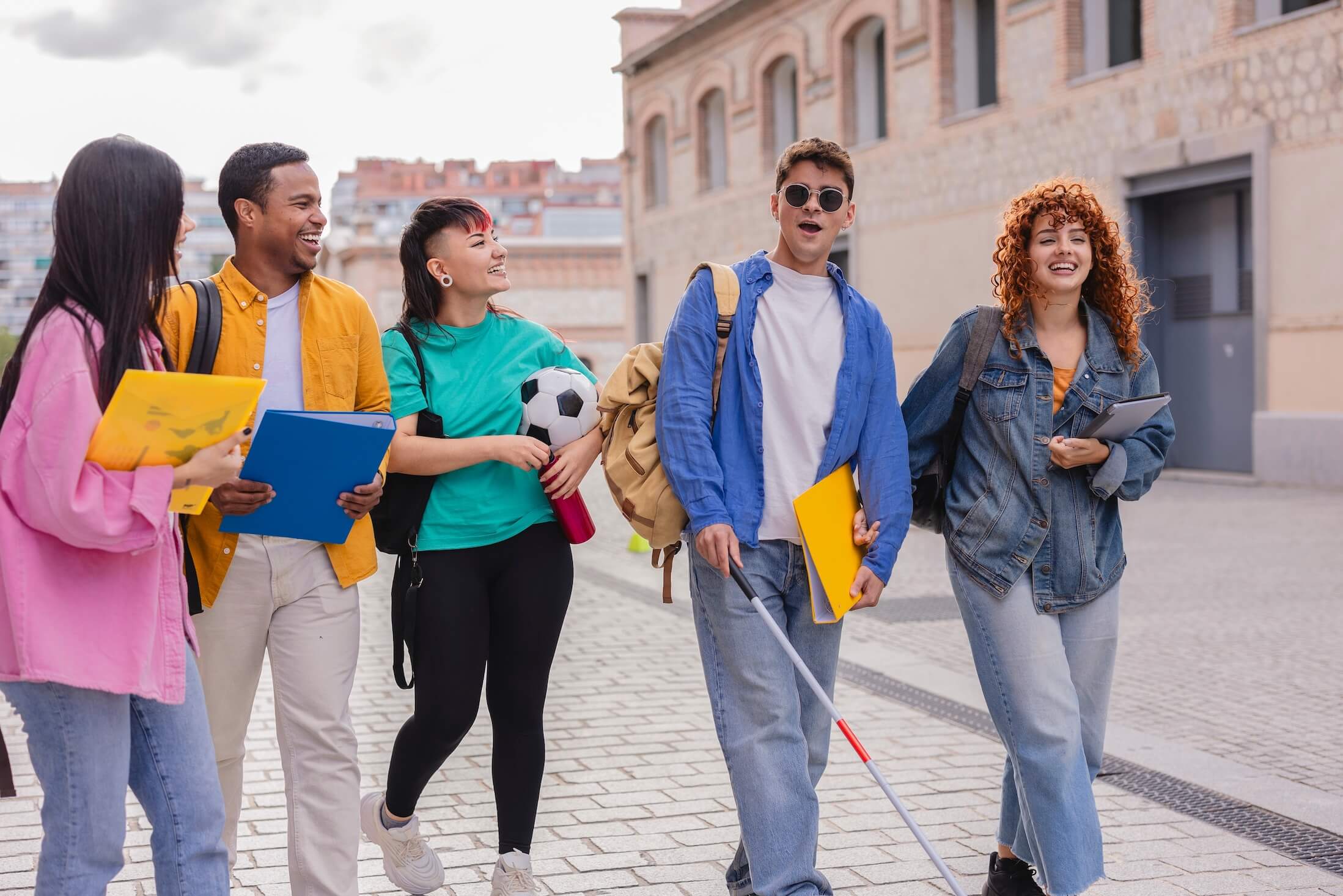 Group,Of,Happy,And,Diverse,University,Students,Walking,Together,On