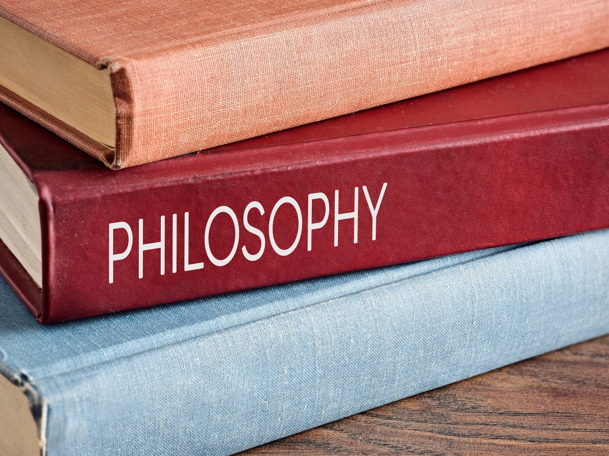 Studying,Philosophy.,Stack,Of,Hardcover,Vintage,Books,On,A,Wooden