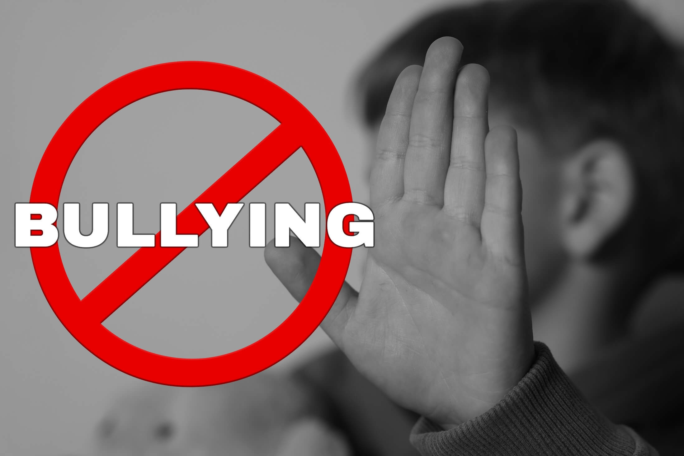Stop,Bullying.,Upset,Little,Boy,Making,Stop,Gesture,,Black,And